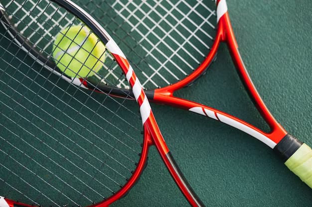 Tennis rackets with ball on the field