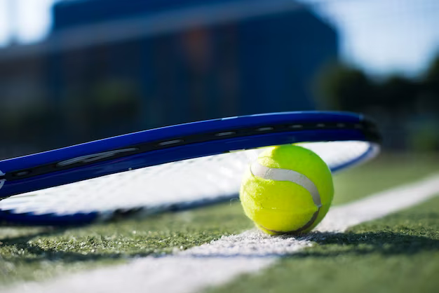 Tennis racket on ball