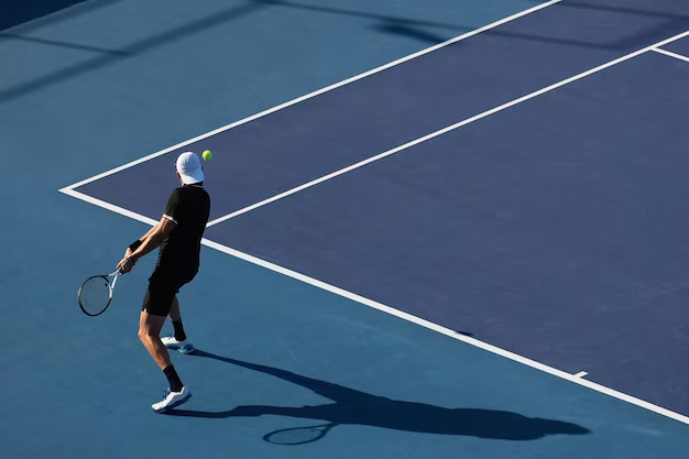 Man in white hat playing tennis