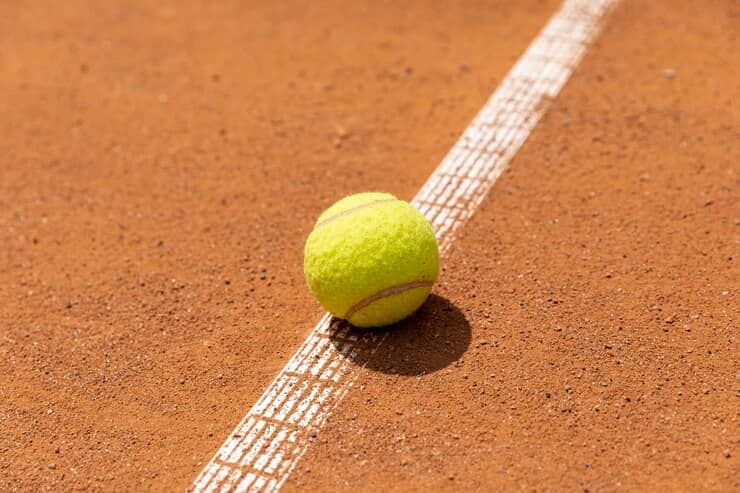 Tennis Ball on Court Ground