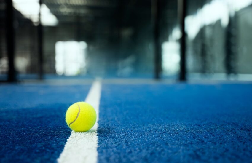 Tennis ball on white line